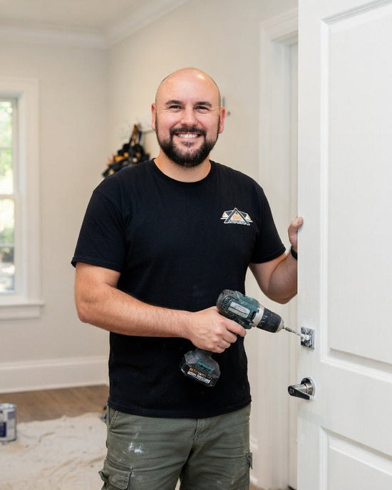 Sean Barriga repairing a residential door 